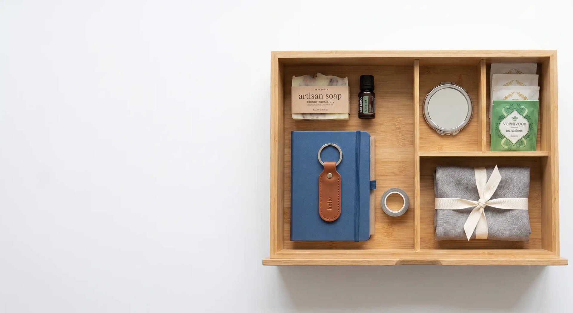 A beautifully organized gift drawer filled with thoughtful everyday essentials in a bright modern home
